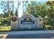 Community entrance sign with welcoming landscaping at 8601 Sandy Plains Dr, Riverview, FL 33578