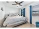 Main bedroom with a king-size bed and blue accents at 4801 14Th S Ave, St Petersburg, FL 33711