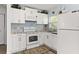 Modern kitchen with white cabinets and granite countertops at 4801 14Th S Ave, St Petersburg, FL 33711