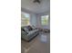 Small living room with light teal couch and starfish pillows at 4801 14Th S Ave, St Petersburg, FL 33711