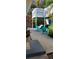Backyard patio with teal chairs and a small sitting area at 4801 14Th S Ave, St Petersburg, FL 33711