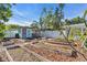 Charming backyard with garden beds and a small shed at 10216 63Rd Ave, Seminole, FL 33772