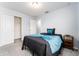 Comfortable bedroom with a bed and built-in closet at 10219 Newel Valley Loop, Riverview, FL 33569