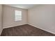 Bright bedroom featuring neutral walls and carpet flooring at 12159 Cattleside Dr, Riverview, FL 33579