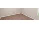 Empty carpeted bedroom with neutral walls at 12163 Cattleside Dr, Riverview, FL 33579