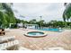 Community pool and spa with ample seating at 129 Camphor Cir # F, Oldsmar, FL 34677