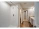 Bathroom with stand-up shower, vanity, and wood-look floors at 12990 Wellspring Dr, Lithia, FL 33547