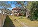 Large backyard with mature trees and a stone pathway at 1530 22Nd S Ave, St Petersburg, FL 33705