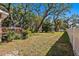 Large backyard with mature trees and a wooden deck at 1530 22Nd S Ave, St Petersburg, FL 33705
