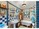 Charming bathroom with blue and white tile, pedestal sink, and clawfoot tub at 1530 22Nd S Ave, St Petersburg, FL 33705