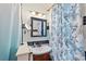 Bathroom with updated vanity and seashell-themed shower curtain at 1530 22Nd S Ave, St Petersburg, FL 33705