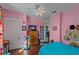 Bright bedroom with pink walls and hardwood floors at 1530 22Nd S Ave, St Petersburg, FL 33705