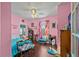 Charming bedroom with pink walls and hardwood floors at 1530 22Nd S Ave, St Petersburg, FL 33705