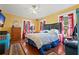 Bright bedroom with hardwood floors and yellow walls at 1530 22Nd S Ave, St Petersburg, FL 33705