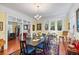 Spacious dining room with hardwood floors, large windows, and view into living room at 1530 22Nd S Ave, St Petersburg, FL 33705