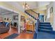 Bright entryway with hardwood floors, staircase, and antique furniture at 1530 22Nd S Ave, St Petersburg, FL 33705
