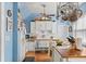 Updated kitchen with white cabinets, wood countertops and ceiling fan at 1530 22Nd S Ave, St Petersburg, FL 33705