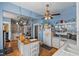 Bright kitchen with white cabinets, wood island and stainless steel appliances at 1530 22Nd S Ave, St Petersburg, FL 33705