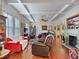 Spacious living room with hardwood floors, a fireplace, and large windows at 1530 22Nd S Ave, St Petersburg, FL 33705