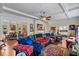 Spacious living area with hardwood floors, sectional sofa, and views to dining area at 1530 22Nd S Ave, St Petersburg, FL 33705
