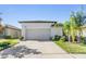 House exterior with driveway and landscaping at 15611 Demory Point Pl, Sun City Center, FL 33573