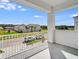 A well-maintained balcony offers neighborhood views and a tranquil outdoor living space at 1979 Longliner Loop, Wesley Chapel, FL 33543