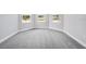 Bright bedroom featuring soft carpet, base trim, neutral walls, and bright natural light at 1979 Longliner Loop, Wesley Chapel, FL 33543