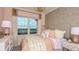 Bright bedroom with large window and pink accents at 1979 Longliner Loop, Wesley Chapel, FL 33543