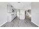 This kitchen has stainless steel appliances, modern white cabinets, and a spacious island at 1979 Longliner Loop, Wesley Chapel, FL 33543