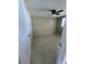 Spacious bedroom with ceiling fan and tile floors at 2215 Riomar Dr, Holiday, FL 34691
