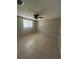 Spacious bedroom with ceiling fan and tile floor at 2215 Riomar Dr, Holiday, FL 34691