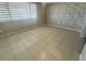 Bright bedroom with tile flooring and large window at 2215 Riomar Dr, Holiday, FL 34691