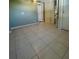Large bedroom with tile flooring and a window at 2215 Riomar Dr, Holiday, FL 34691