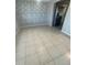 Dining area with tile floor and stone wall accent at 2215 Riomar Dr, Holiday, FL 34691