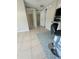 Hallway with tile floors and access to rooms at 2215 Riomar Dr, Holiday, FL 34691