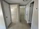 Hallway with doors to bedrooms and bathroom at 2215 Riomar Dr, Holiday, FL 34691