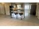 Bright kitchen with breakfast bar, updated countertops, and a modern aesthetic at 2215 Riomar Dr, Holiday, FL 34691