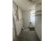 Laundry area with washer/dryer hookups and ample shelving at 2215 Riomar Dr, Holiday, FL 34691