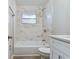 Updated bathroom with a shower/tub combo and white vanity at 2412 38Th W Ave, Bradenton, FL 34205