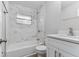 Updated bathroom with a shower/tub combo and white vanity at 2412 38Th W Ave, Bradenton, FL 34205