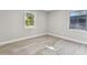 Bright bedroom with wood-look floors and large windows at 2412 38Th W Ave, Bradenton, FL 34205