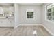 Spacious dining area with hardwood floors and large windows offering natural light at 2412 38Th W Ave, Bradenton, FL 34205