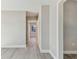 Bright hallway with light gray walls and wood-look flooring at 2412 38Th W Ave, Bradenton, FL 34205