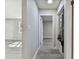 Hallway with light gray walls and wood-look floors at 2412 38Th W Ave, Bradenton, FL 34205