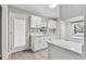 Modern kitchen with white shaker cabinets and quartz counters at 2412 38Th W Ave, Bradenton, FL 34205