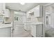 Modern kitchen with white shaker cabinets and quartz counters at 2412 38Th W Ave, Bradenton, FL 34205