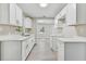 Modern kitchen with white shaker cabinets and quartz counters at 2412 38Th W Ave, Bradenton, FL 34205