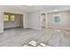 Spacious living area with hardwood-look flooring and an open floor plan at 2412 38Th W Ave, Bradenton, FL 34205