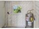 Utility room with water heater and exposed plumbing at 2412 38Th W Ave, Bradenton, FL 34205