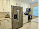 Modern kitchen with stainless steel appliances and white shaker cabinets at 2440 Enterprise Rd # 4, Clearwater, FL 33763